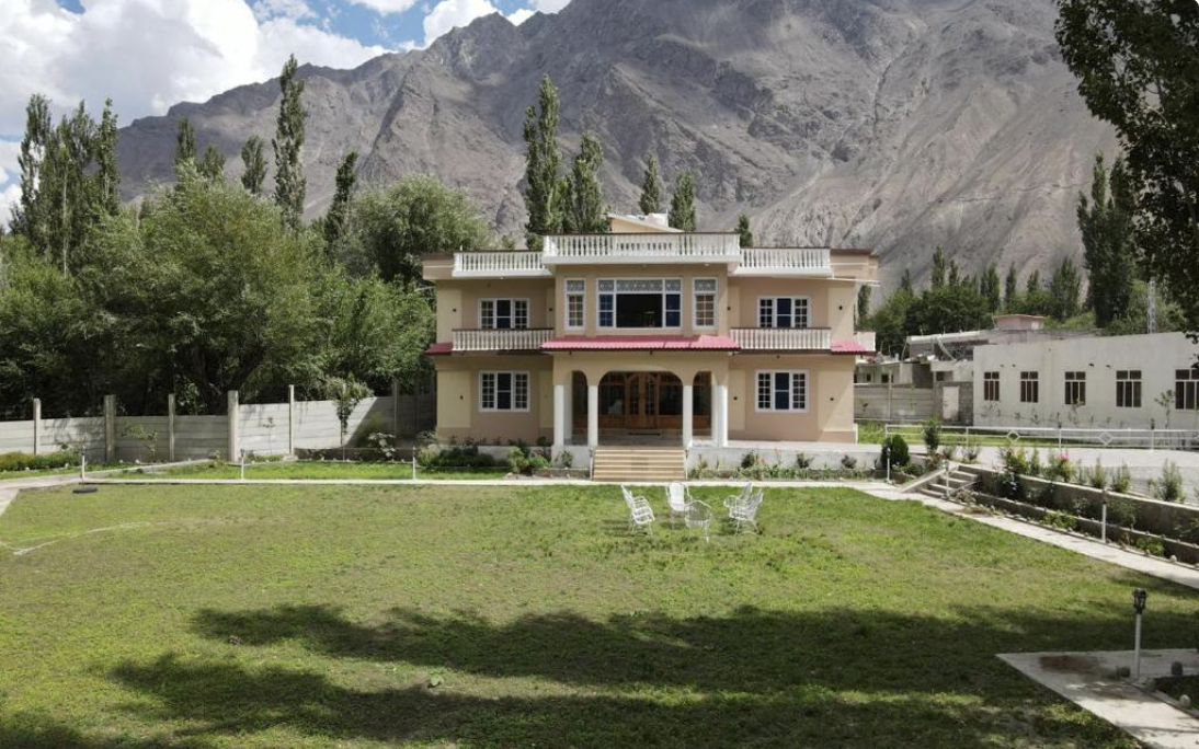 Areena Hotel exterior with mountain backdrop, Skardu