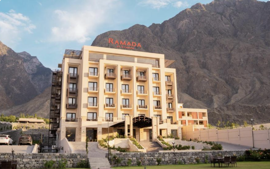 Exterior of Ramada Resort by Wyndham Gilgit with mountain backdrop