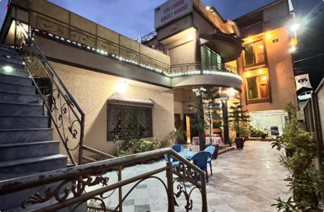 Evening exterior view of The Lodge Guest House, Muzaffarabad