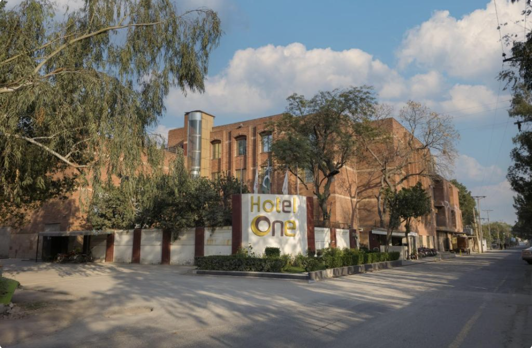 Brick exterior and signage of Hotel One Faisalabad