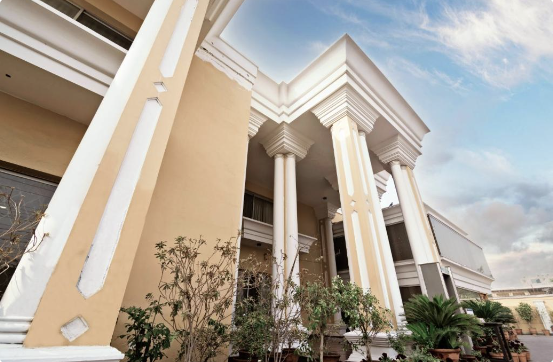 Colonnaded entrance of Hotel One Tariq Road Multan