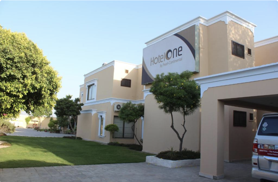 Hotel One Bahawalpur exterior with garden courtyard