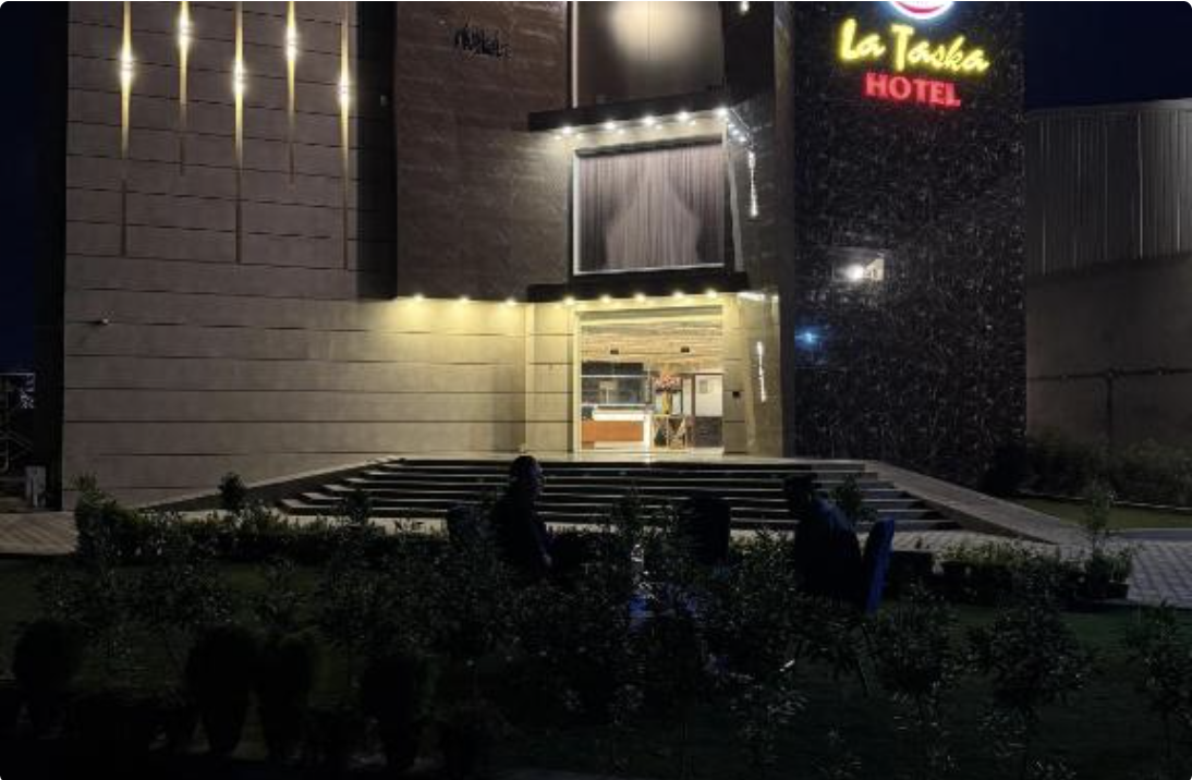 Lataska Hotel illuminated exterior at night